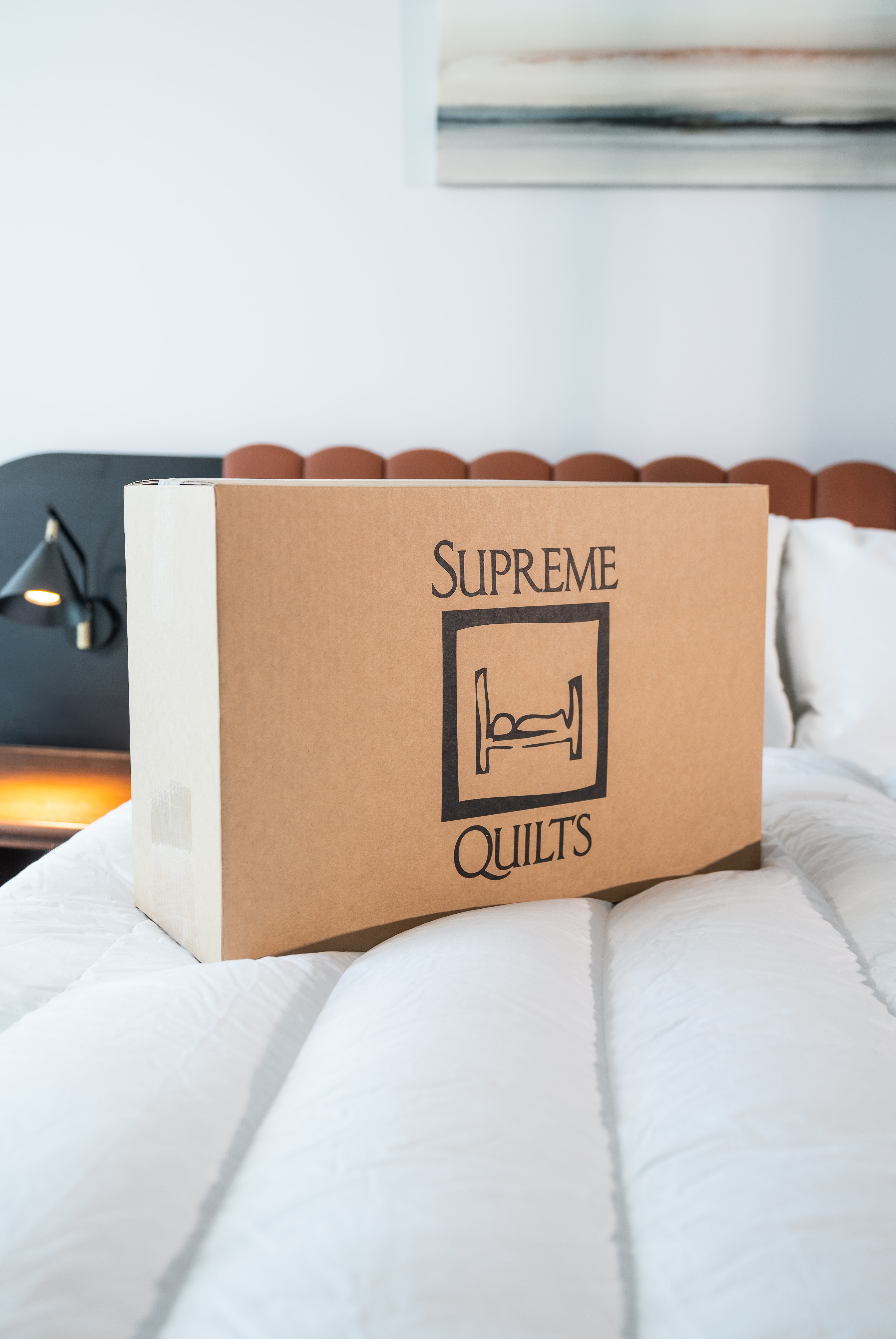 A clean, minimalist quilt filled with fine goose down for breathable comfort and subtle elegance