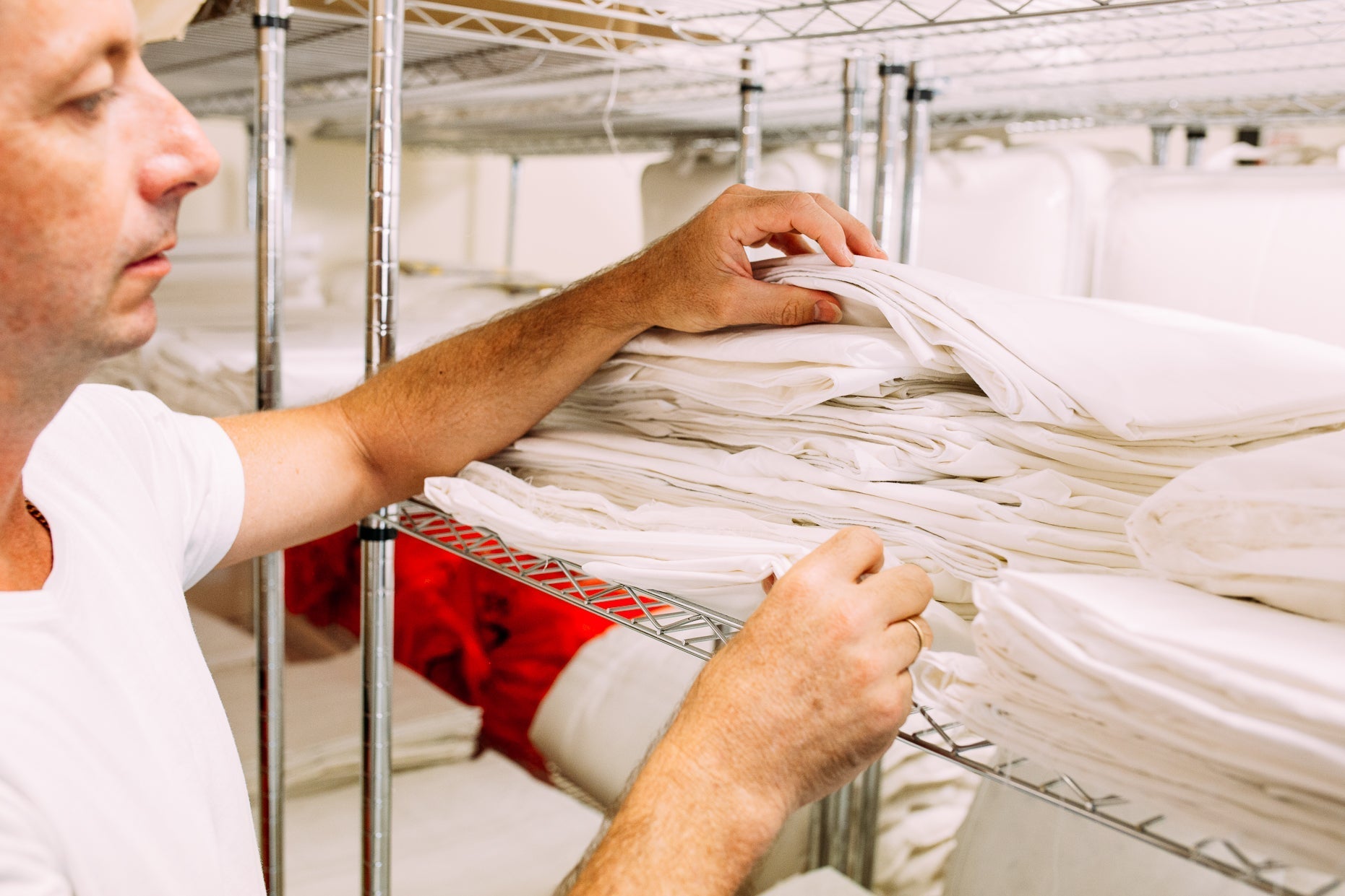 Supreme Quilts channeled goose down quilt being expertly crafted with precision stitching and premium materials.